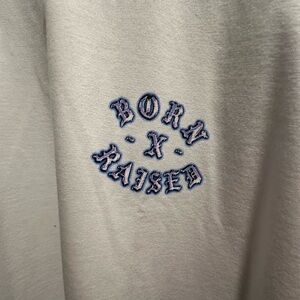 Born x raised on our turf tee
